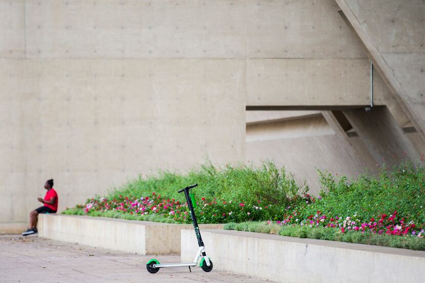 A Lime scooter sits outside City Hall in downtown Dallas.