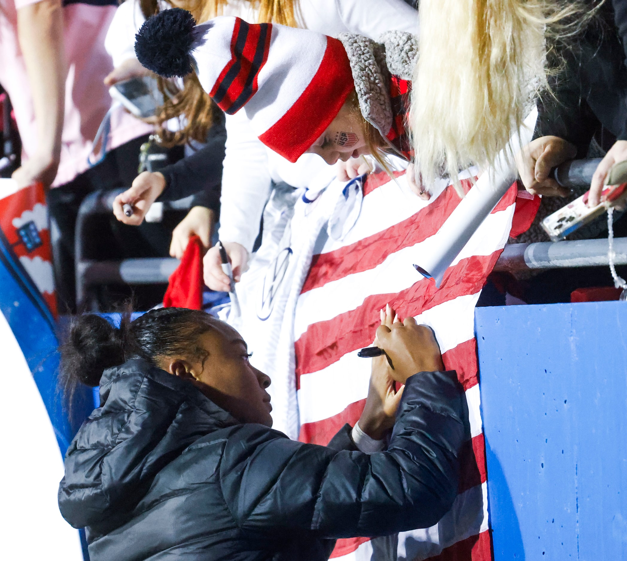 Untied State’s Jaedyn Shaw gives autograph to a fan after a soccer game against China, on...