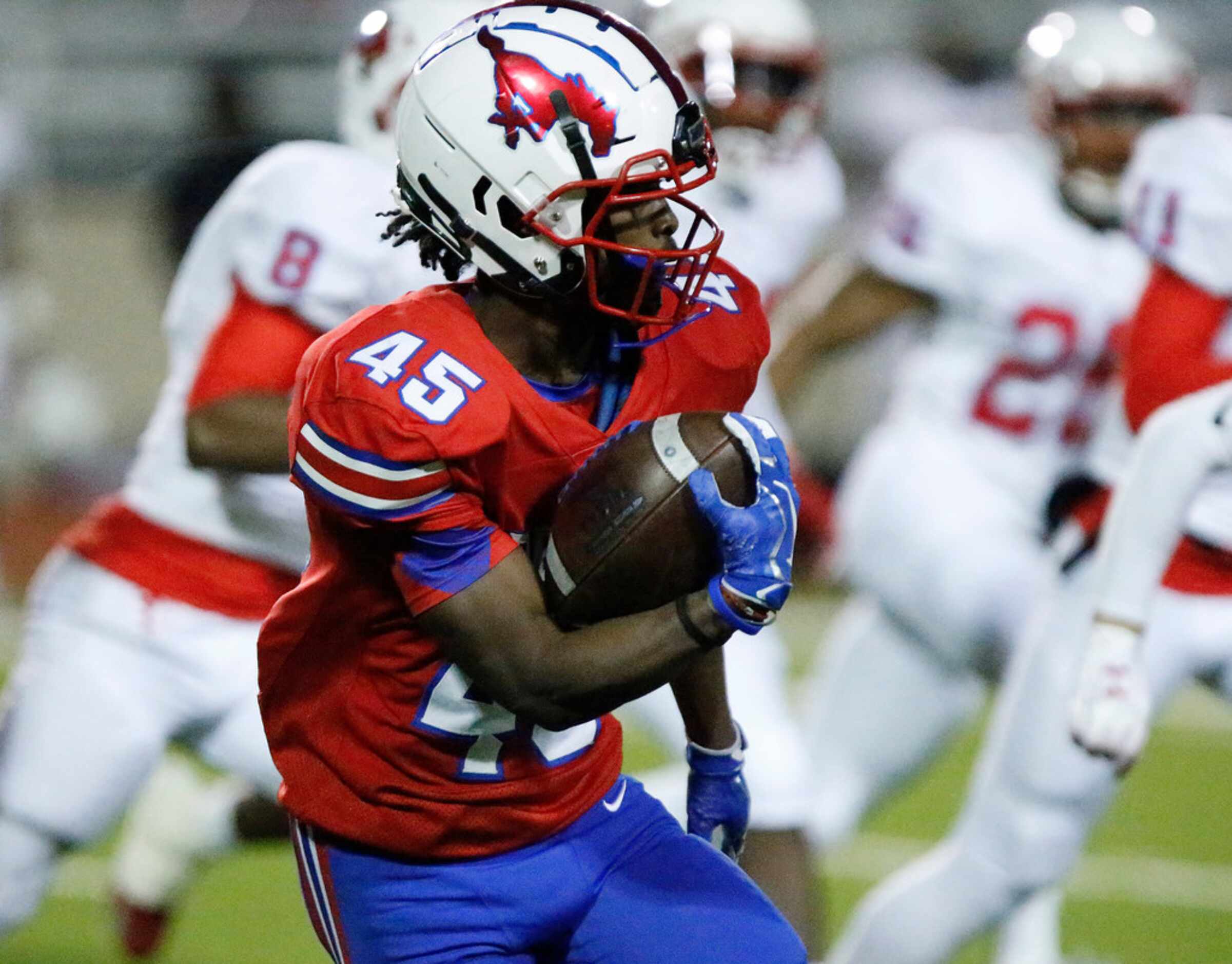 J.J. Pearce High School running back Dequan Landon (45) carries the ball during the first...