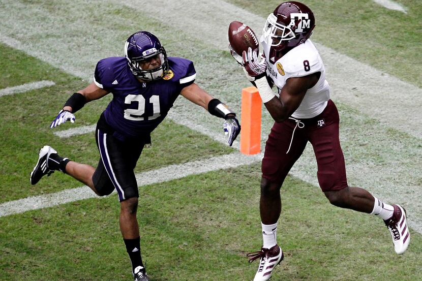 Northwestern Wildcats cornerback Mike Bolden (21) can't stop Texas A&M Aggies wide receiver...