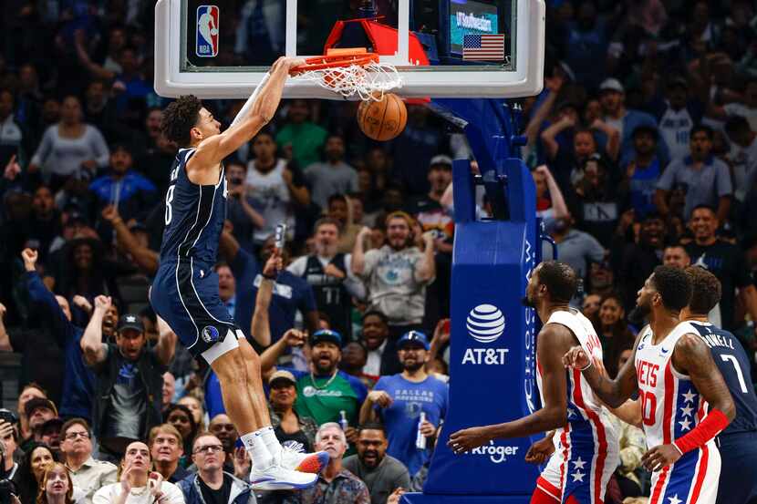 Dallas Mavericks guard Josh Green (8) dunks the ball during the second half of an NBA game...