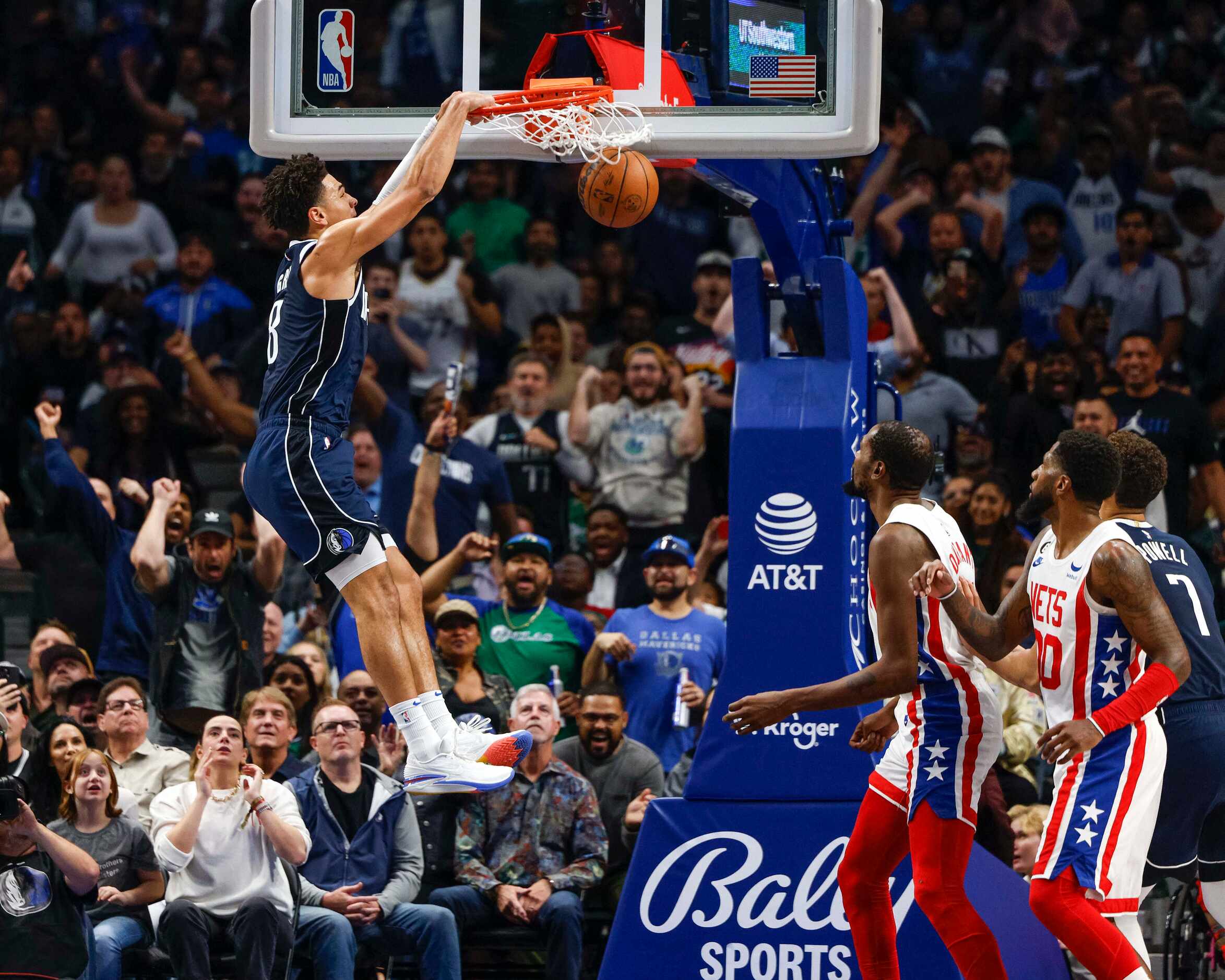 Dallas Mavericks guard Josh Green (8) dunks the ball during the second half of an NBA game...