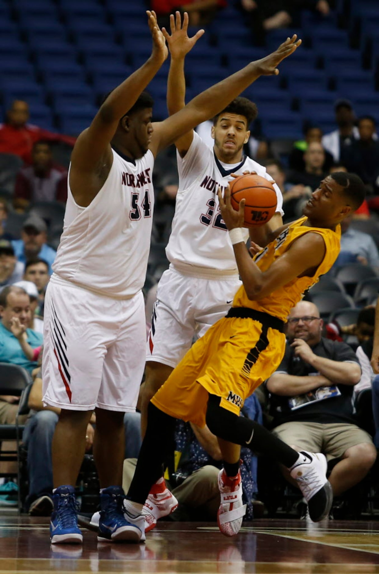 Justin Northwest's Darrell Simpson (54) and Jay Am'Mons (32) block Fort Bend Marshall's...