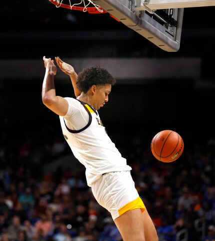 Oak Cliff Faith Family Academy Doryan Onwuchekwa (2) dunks in a Class 4A state semifinal on...