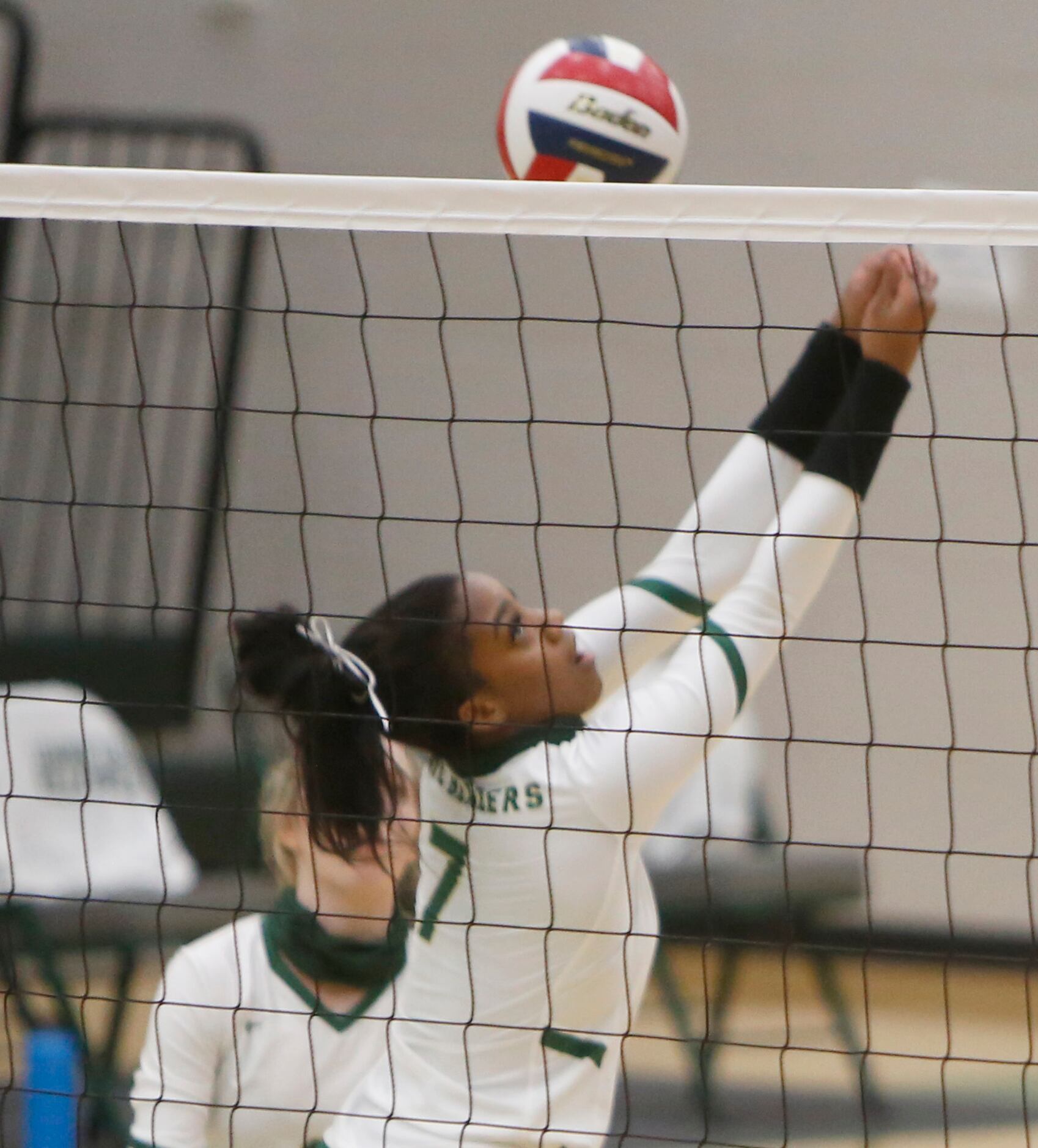 Frisco Lebanon Trail's Tyrah Ariail (7) reaches to return the ball during the first set of...
