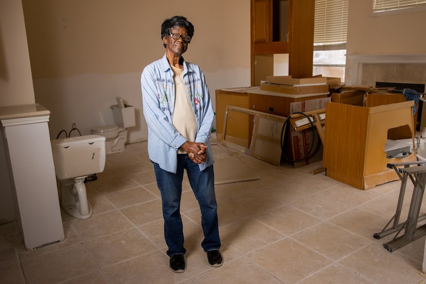 Rubino Maxwell poses in what used to be her home’s living room. Maxwell was repairing her...