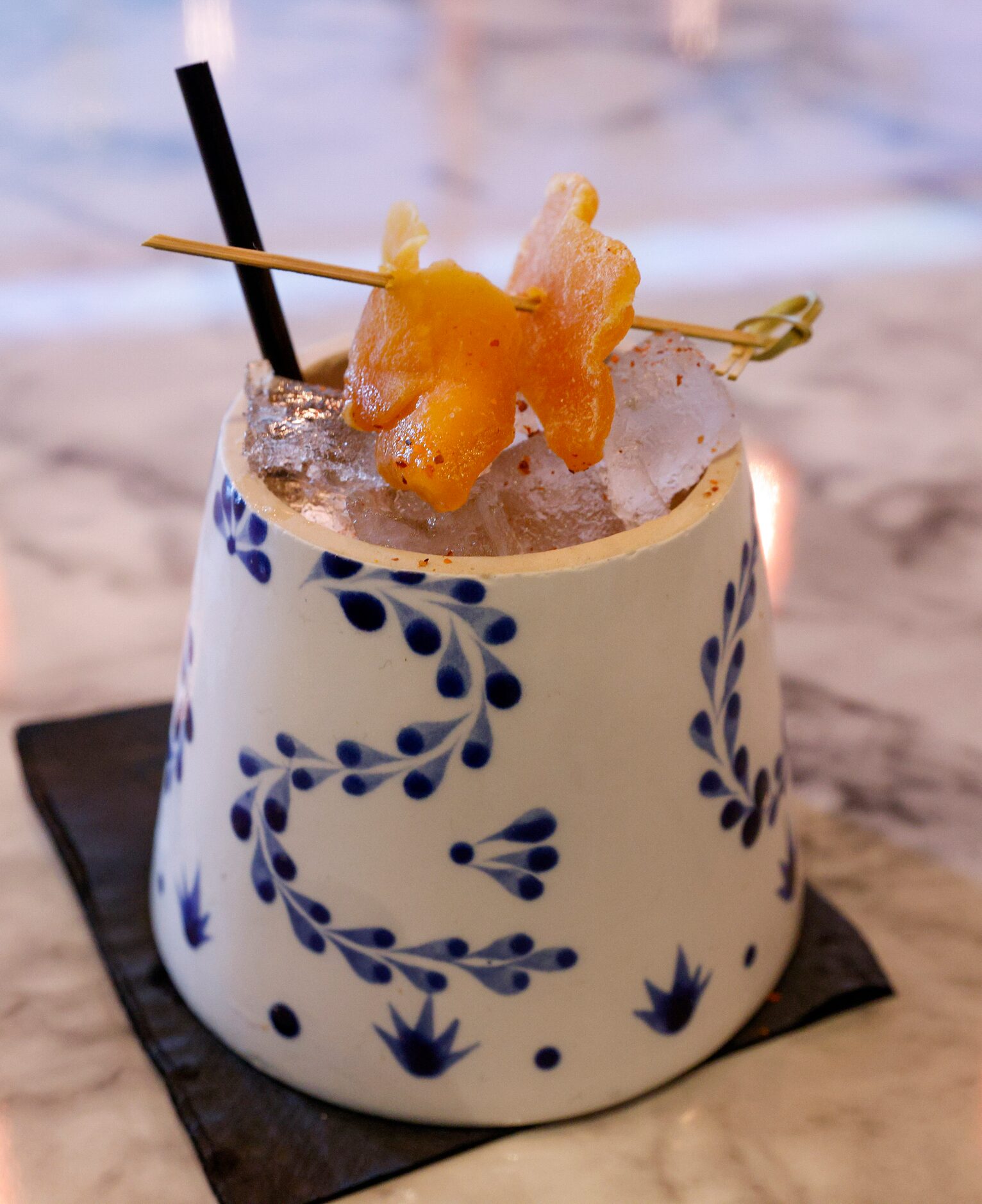 The mango tango cocktail served in a hand cut Close Azul bottle at Snowbird, Thursday, Oct....