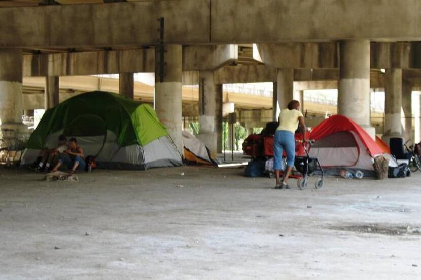  More than 250 people were living in Tent City, under Interstate 45 near downtown, at last...