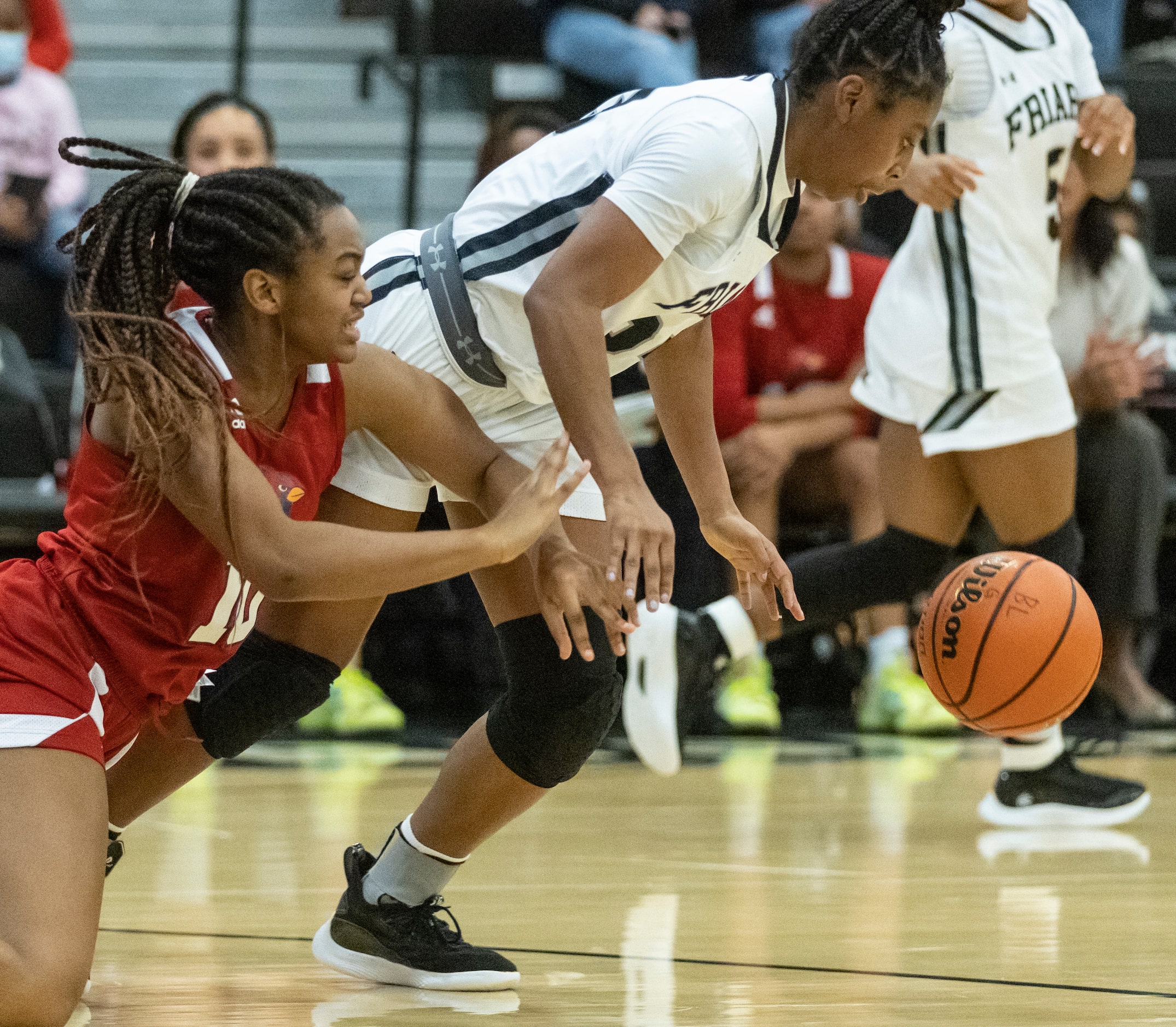 John Paul II High School Destiny Jones (10) dives to grab the loose ball as Bishop Lynch...