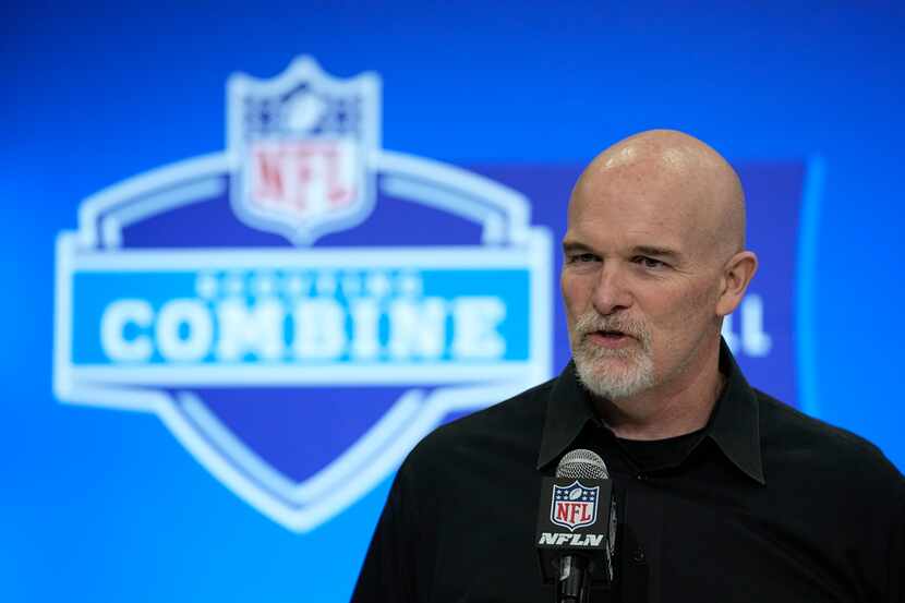 Washington Commanders head coach Dan Quinn speaks during a news conference at the NFL...