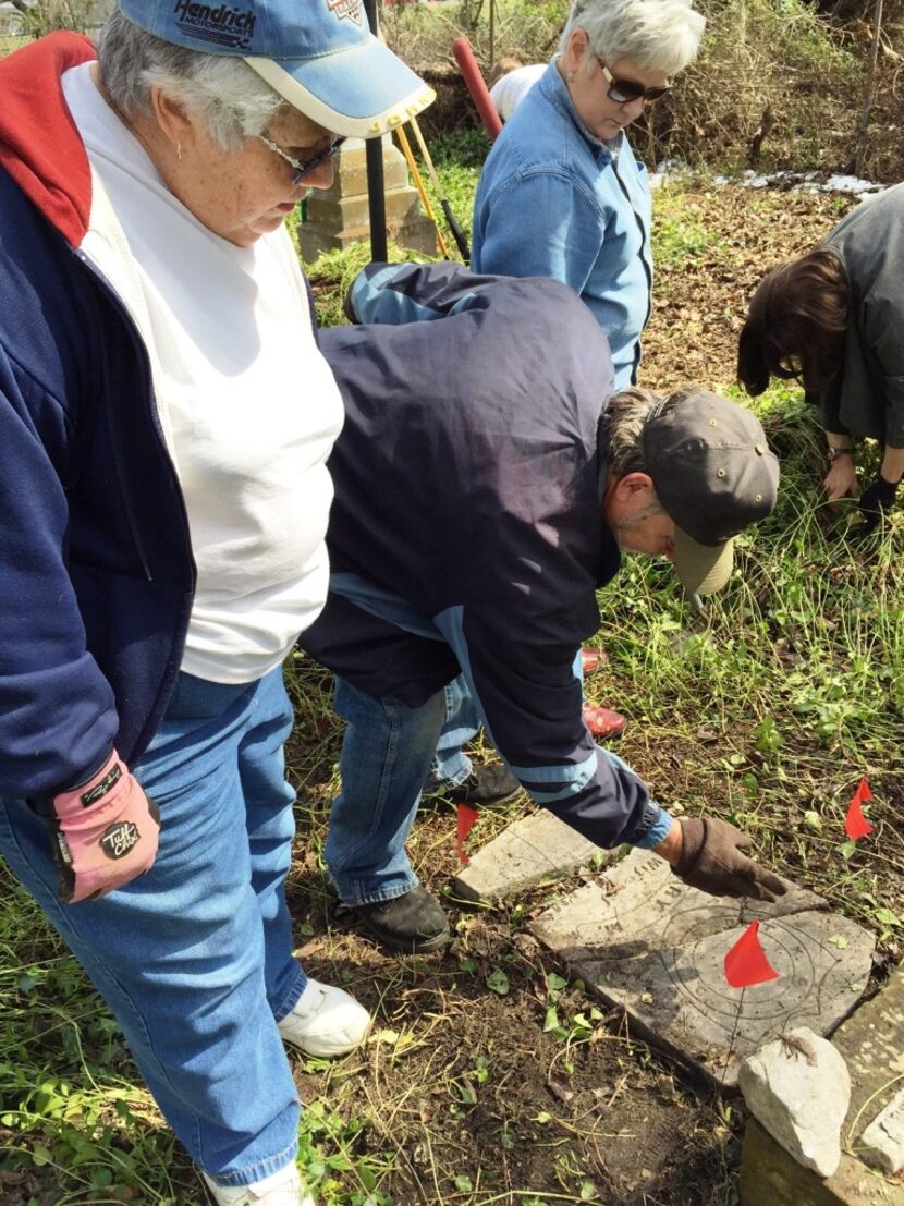  Donna Spears, left, looks at the tidied grave of her ancestor, Mary Smith McAdams, along...