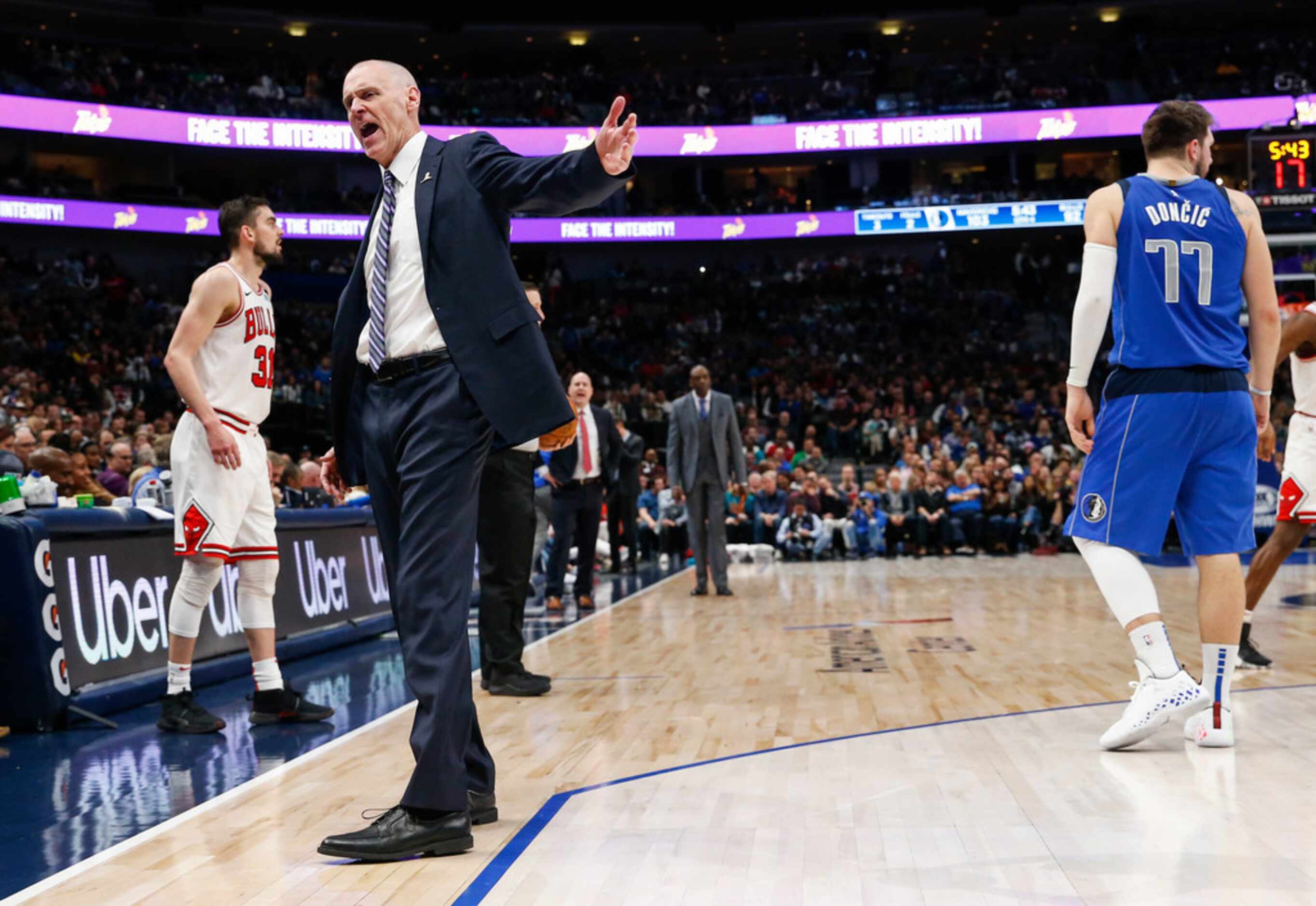 Dallas Mavericks head coach Rick Carlisle calls a player from the bench during the second...