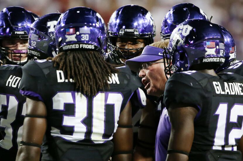 TCU head coach Gary Patterson talks to his players in the second half during an NCAA...