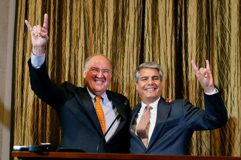 Interim athletic director Michael Perrin and University of Texas President Gregory Fenves...