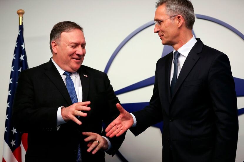 U.S. Secretary of State Mike Pompeo (left) speaks with NATO Secretary General Jens...