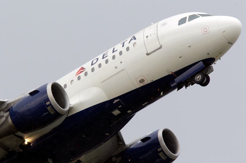 In this photo taken July 22, 2011 a Delta airlines jet takes off at the Detroit Metropolitan...