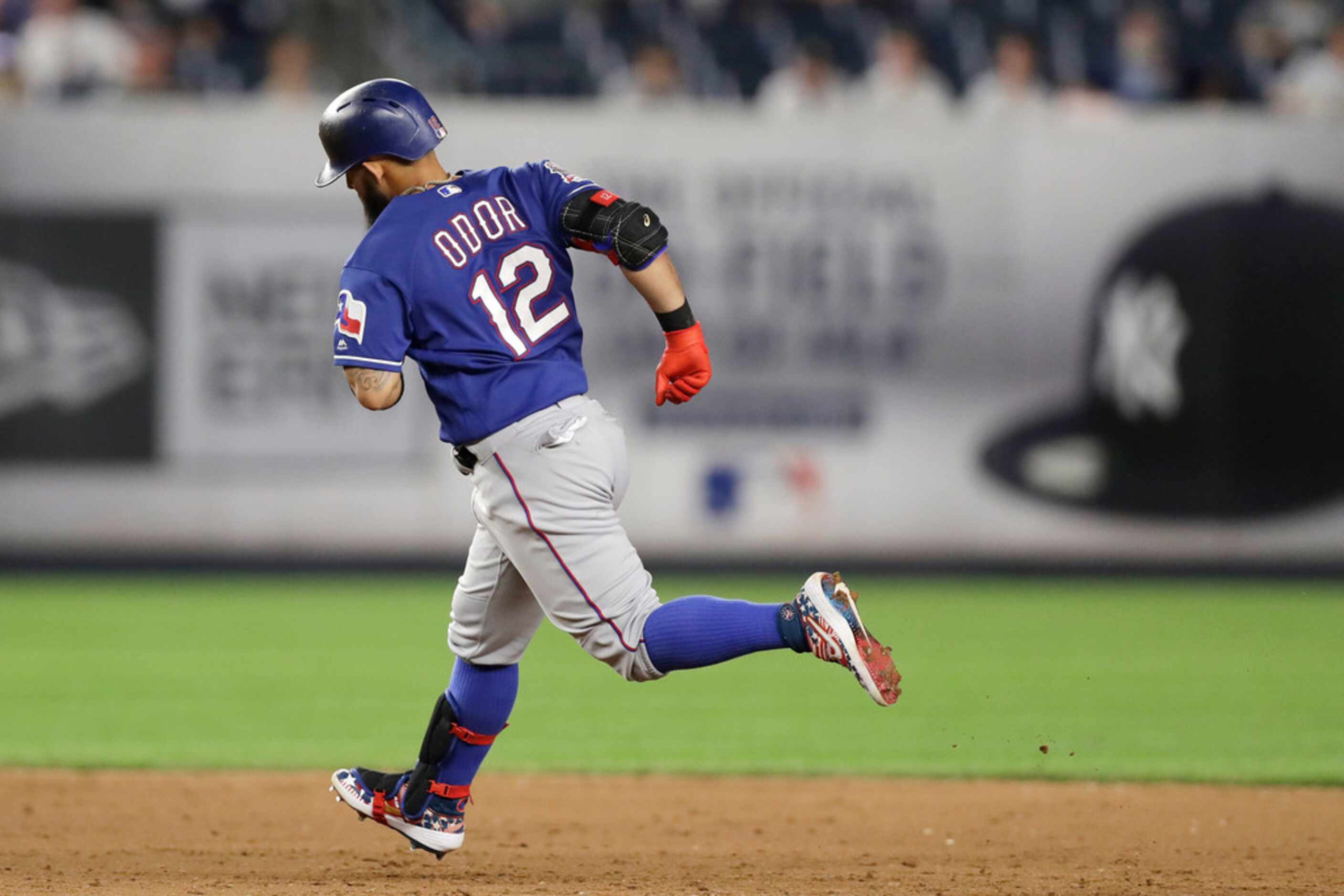 Texas Rangers' Rougned Odor runs the bases after hitting a solo home run in the ninth inning...