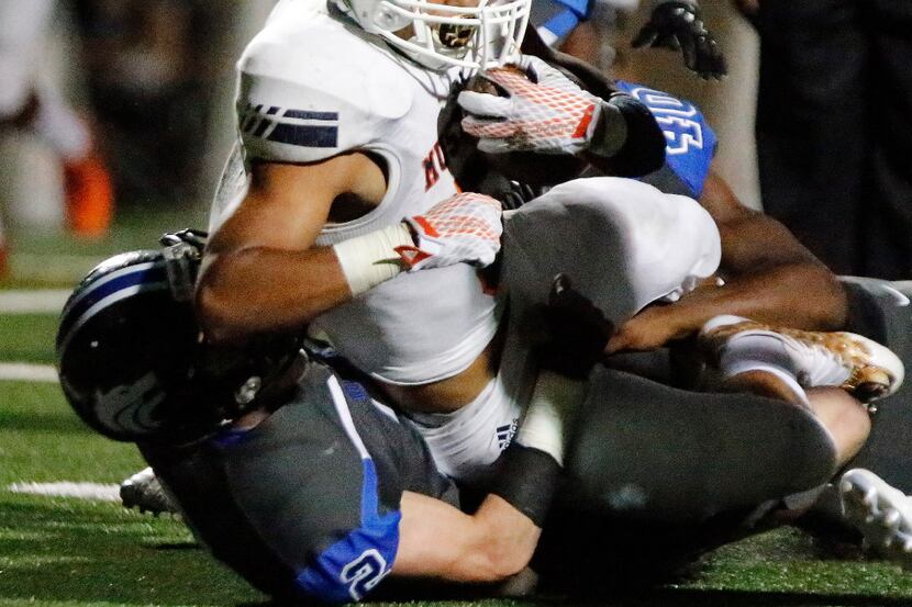Sachse High School running back Christian Cole (5) lunges across the goal line for a...