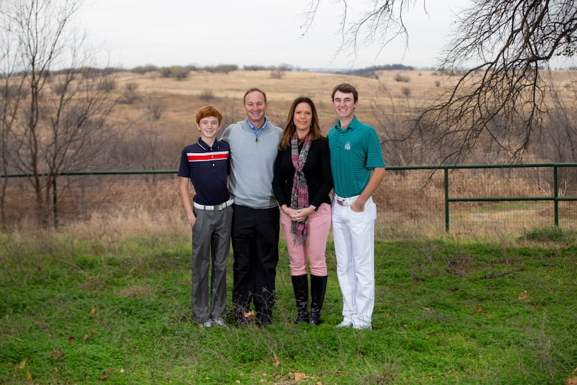 David Ovard, his wife, Wren, and their two sons Davis, 13, (left) and Dawson, 17, stand on...