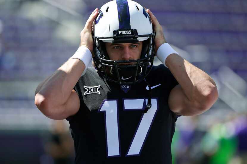 FILE - In this Oct. 7, 2017, file photo, TCU quarterback Grayson Muehlstein (17) warms up...