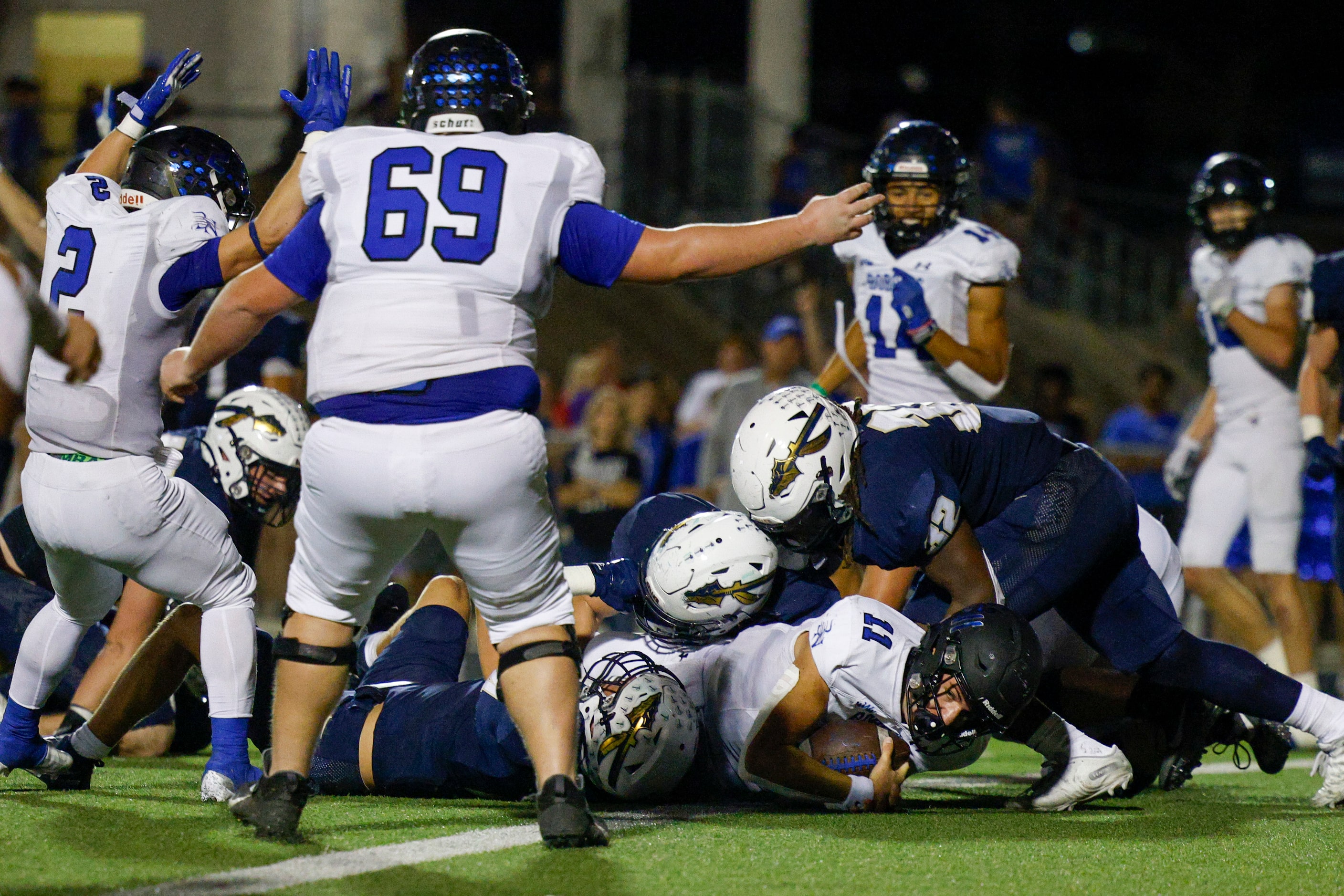 Trophy Club Byron Nelson quarterback Jake Wilson (11) rushes for a touchdown during the...