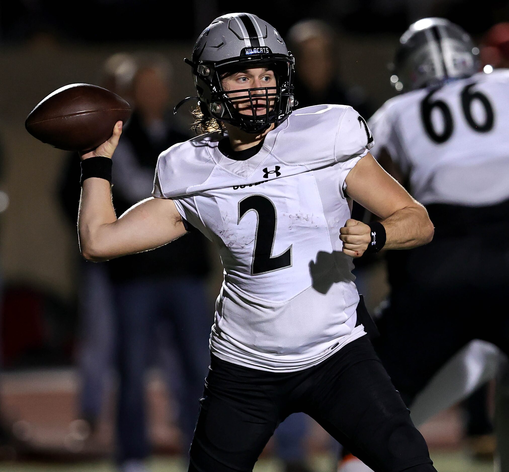 Denton Guyer quarterback Logan McLaughlin looks to make a pass against Coppell during first...