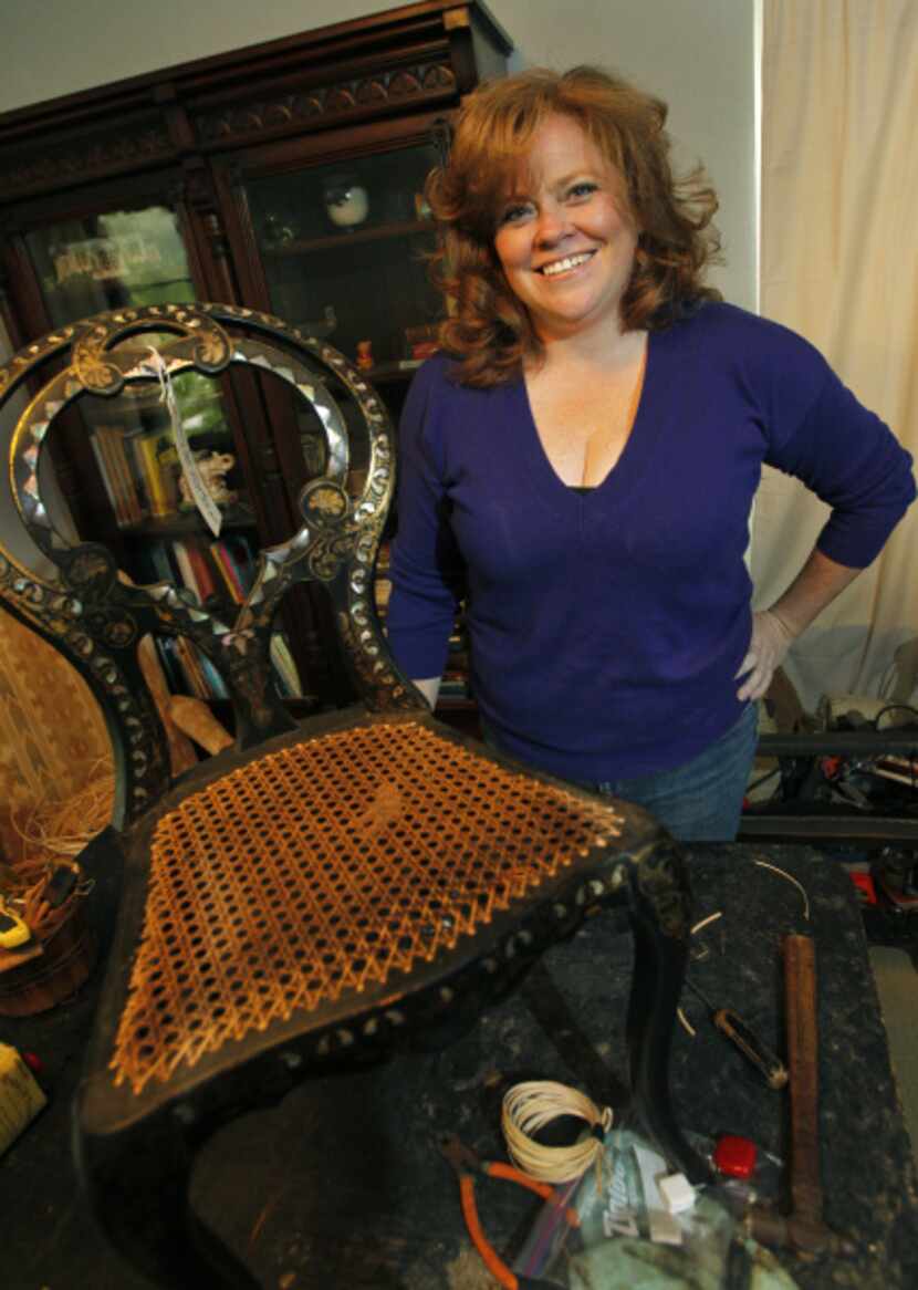 Louise Herriott does caning and makes handwoven rush seats for chairs at her home in Dallas...