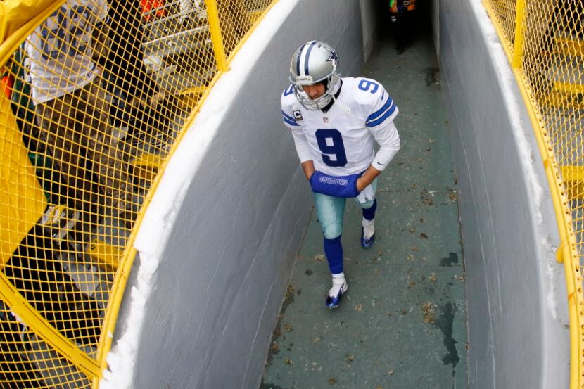 Dallas Cowboys quarterback Tony Romo (9) walks out of the tunnel to face the Green Bay...