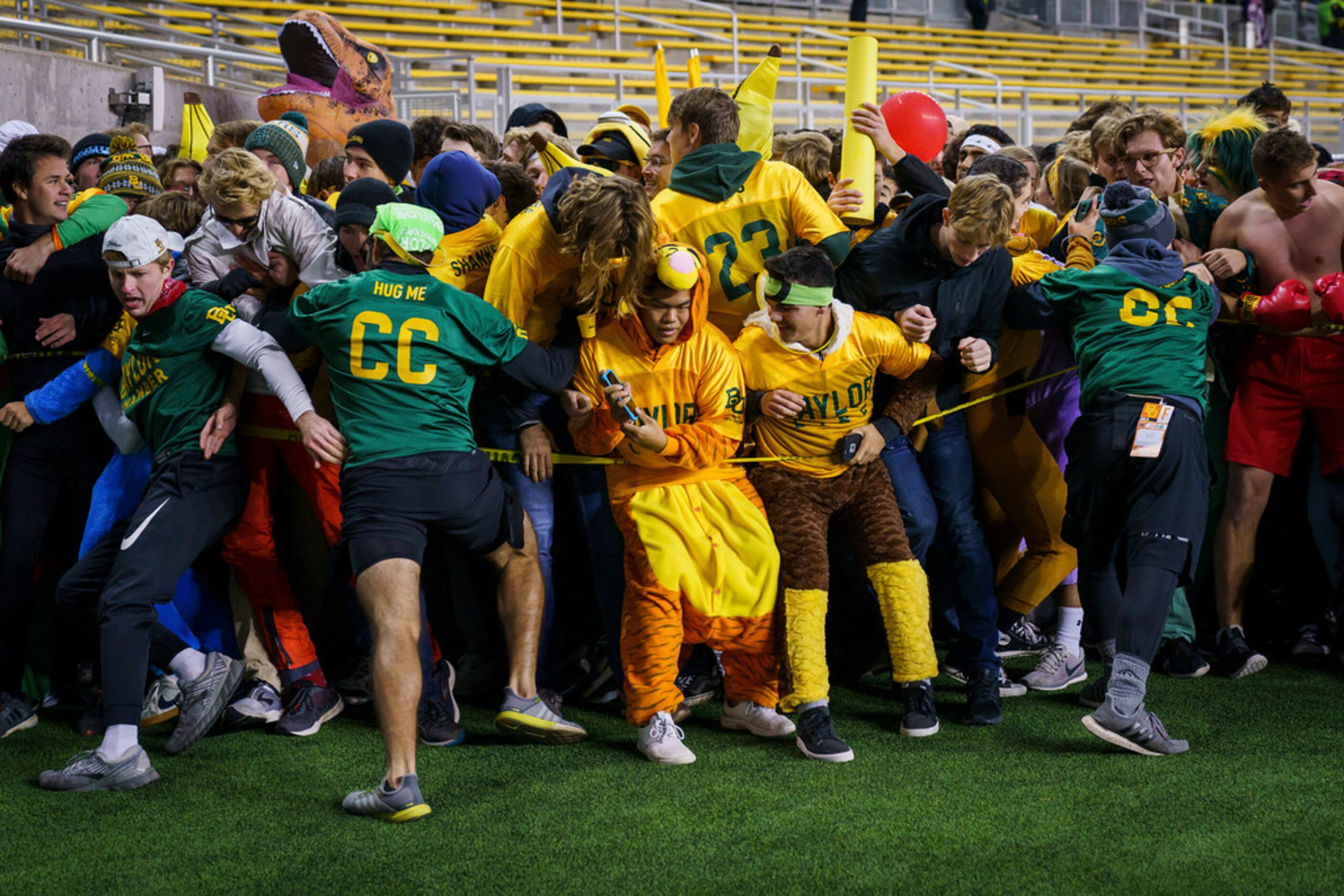 Baylor fans form the line before their team takes the field to face West Virginia in an NCAA...