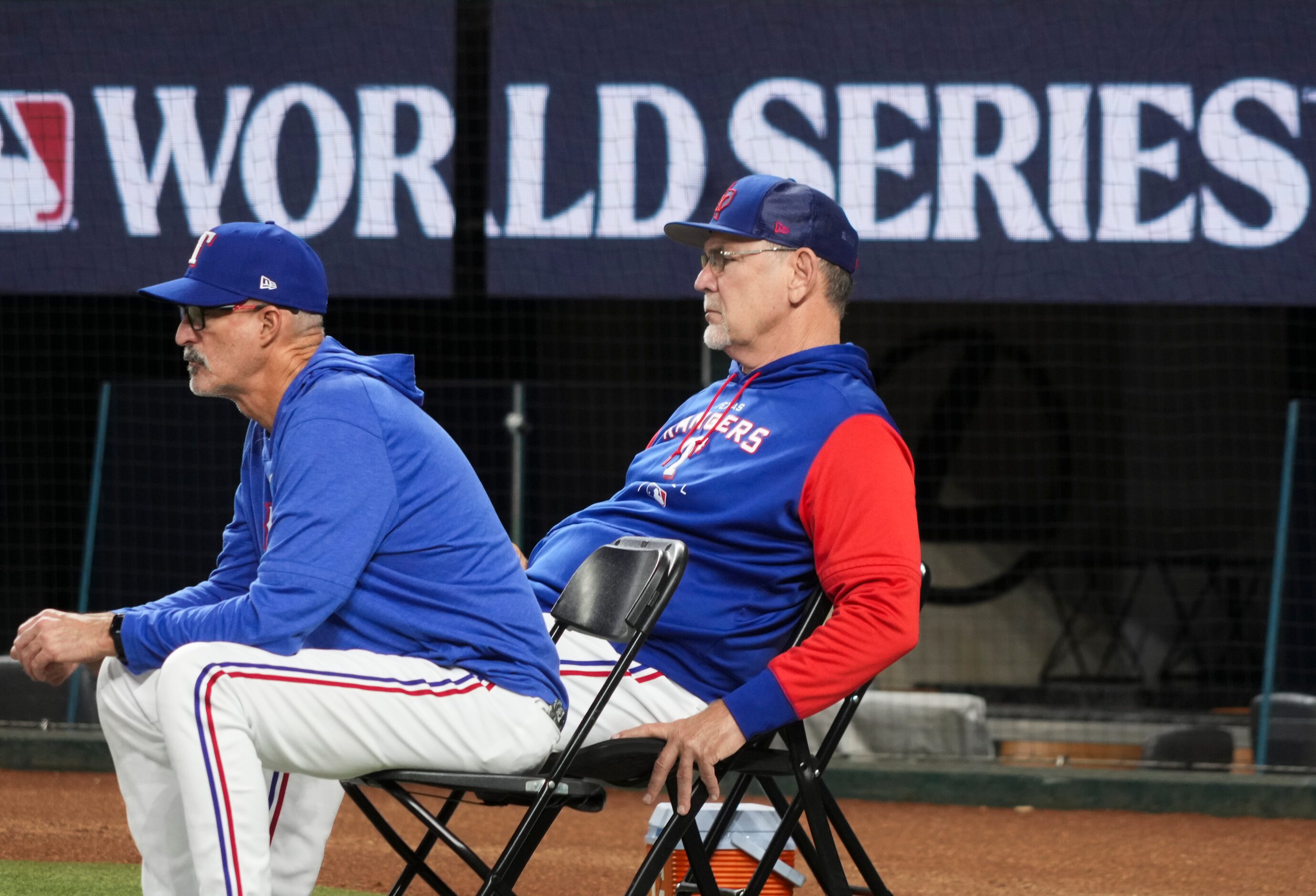 Texas Rangers pitching coach Mike Maddux (left) and manager Bruce Bochy watch pitcher Dane...