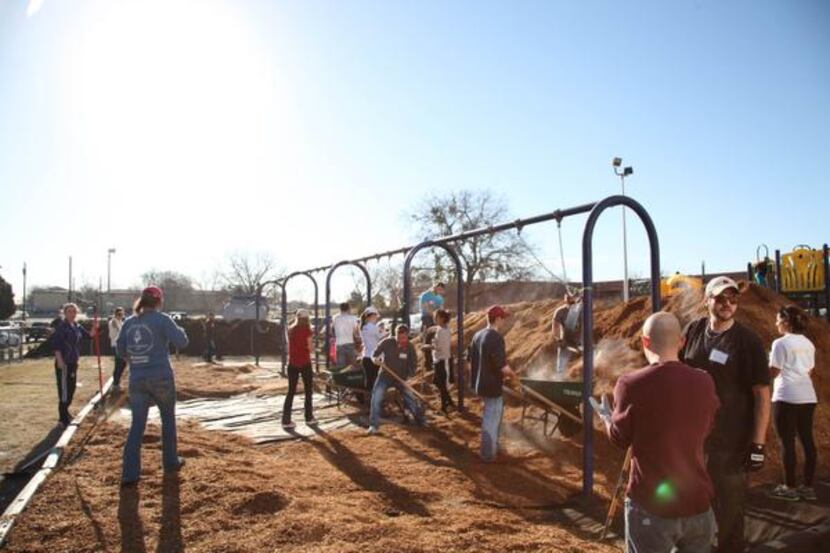 
Mulch was spread across the playground at City Park Elementary during a service day for...