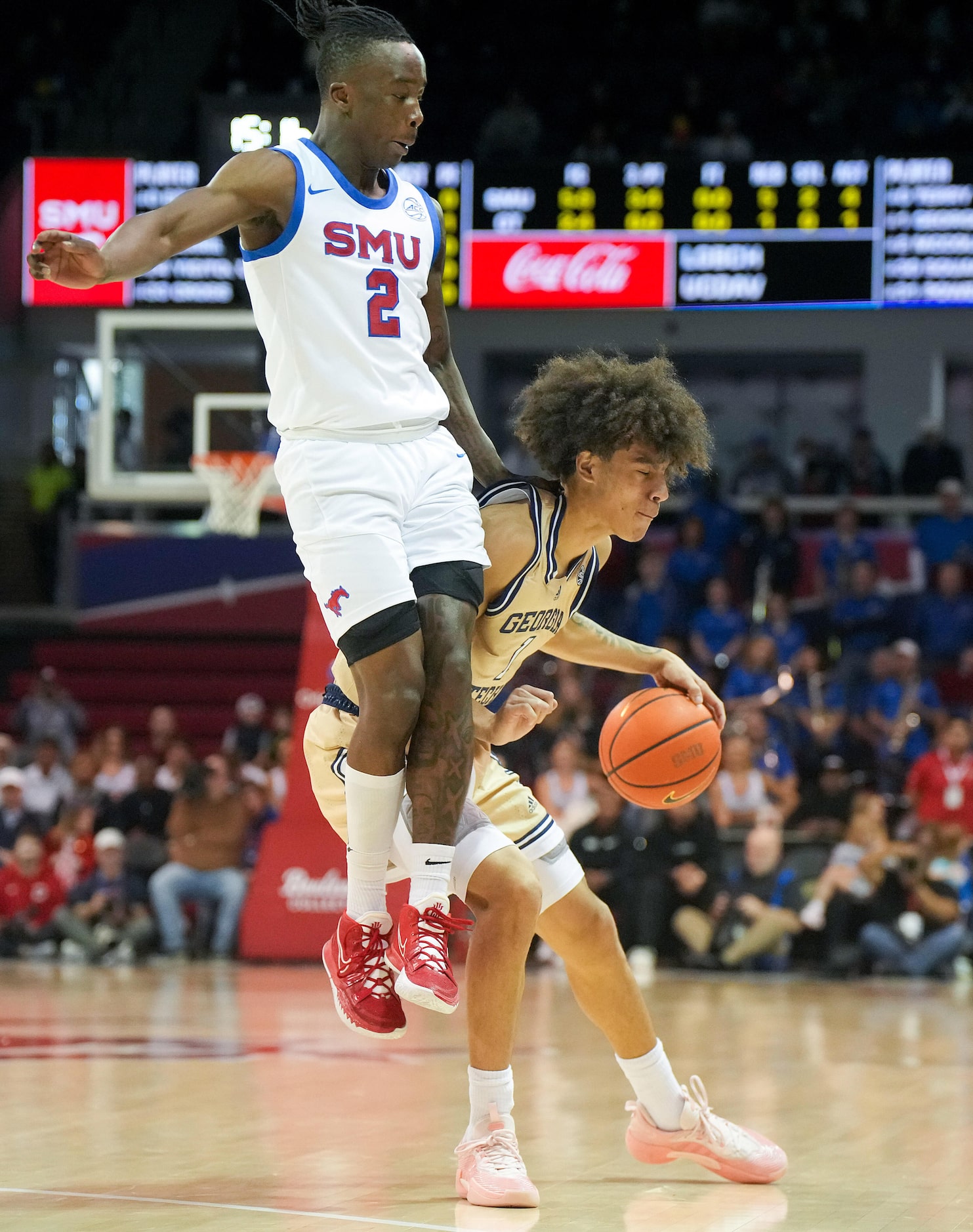 Georgia Tech guard Naithan George (1) is fouled by SMU guard Boopie Miller (2) during the...