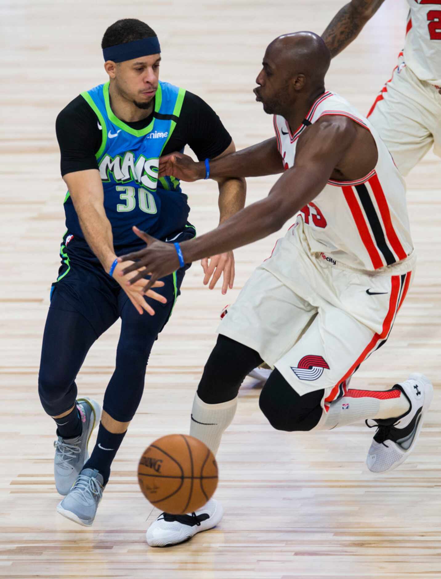 Dallas Mavericks guard Seth Curry (30) steals a ball from Portland Trail Blazers forward...
