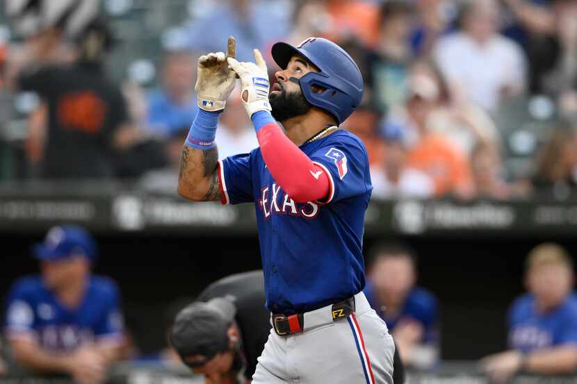 Texas Rangers' Derek Hill celebrates after his two-run home run during the second inning of...