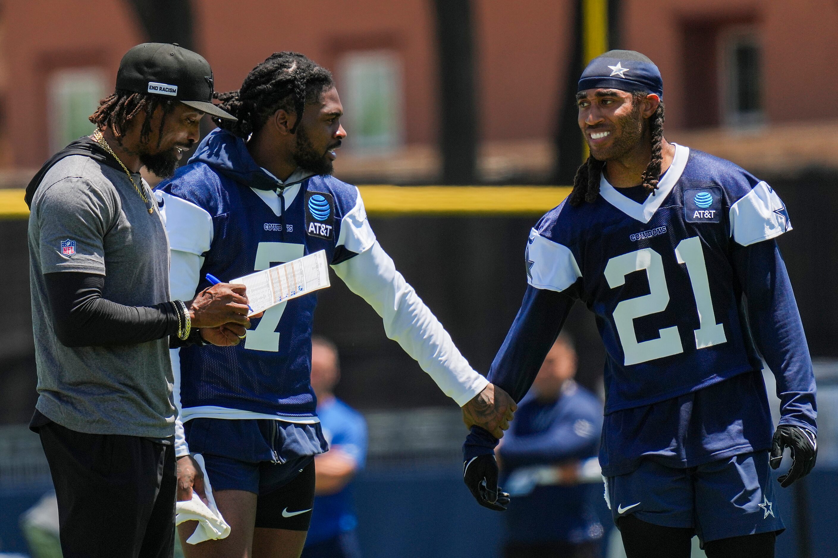 Dallas Cowboys cornerback Trevon Diggs (7) talks with defensive backs coach Al Harris and...