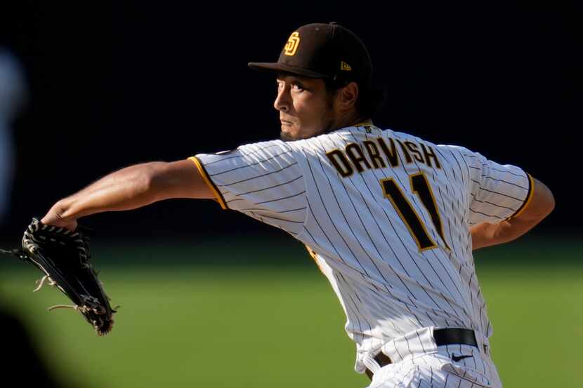 San Diego Padres starting pitcher Yu Darvish works against a Texas Rangers batter during the...