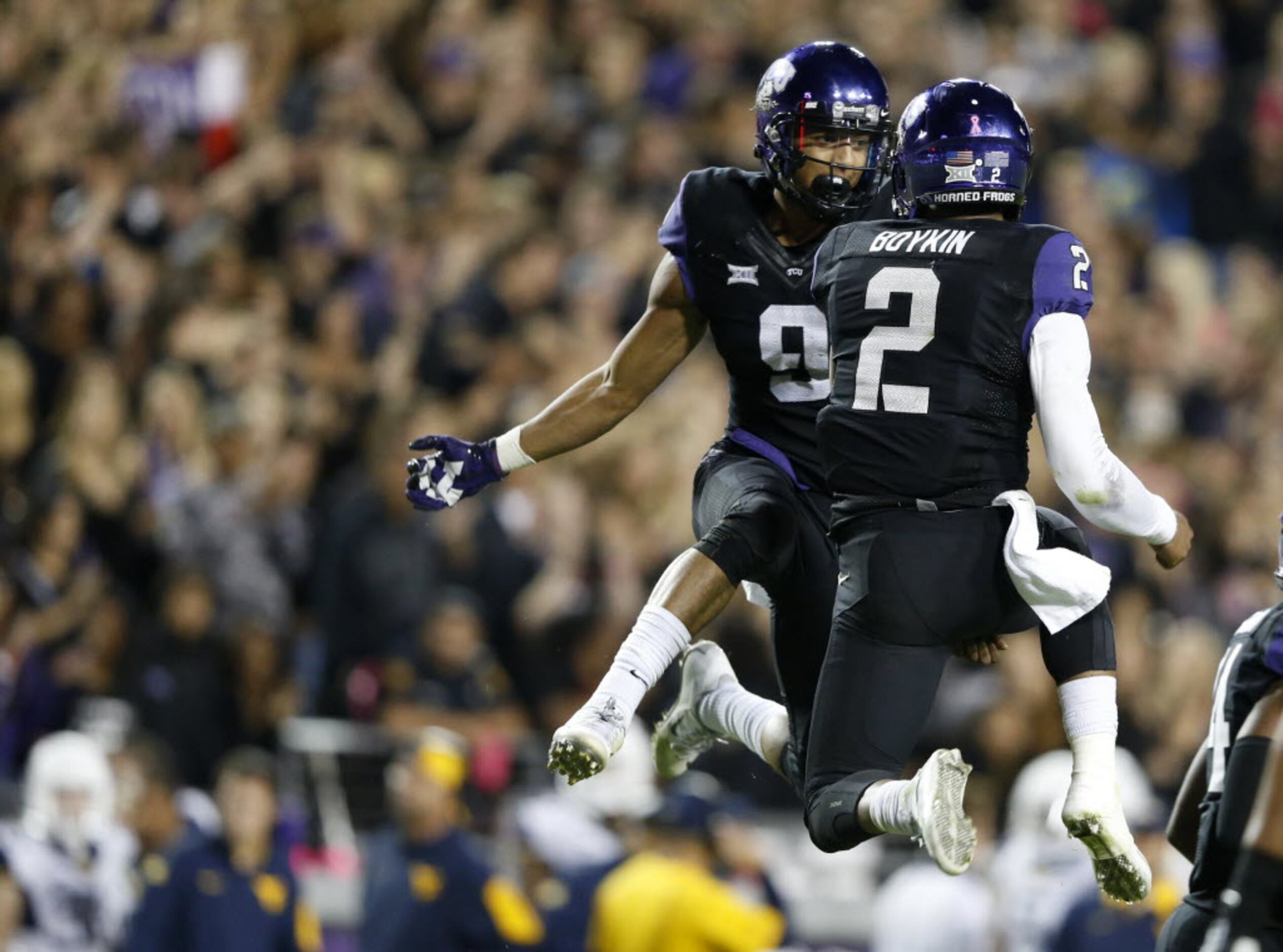 Quarterback Trevone Boykin #2 of the TCU Horned Frogs looks for an open  receiver against the Oklahoma Soon…