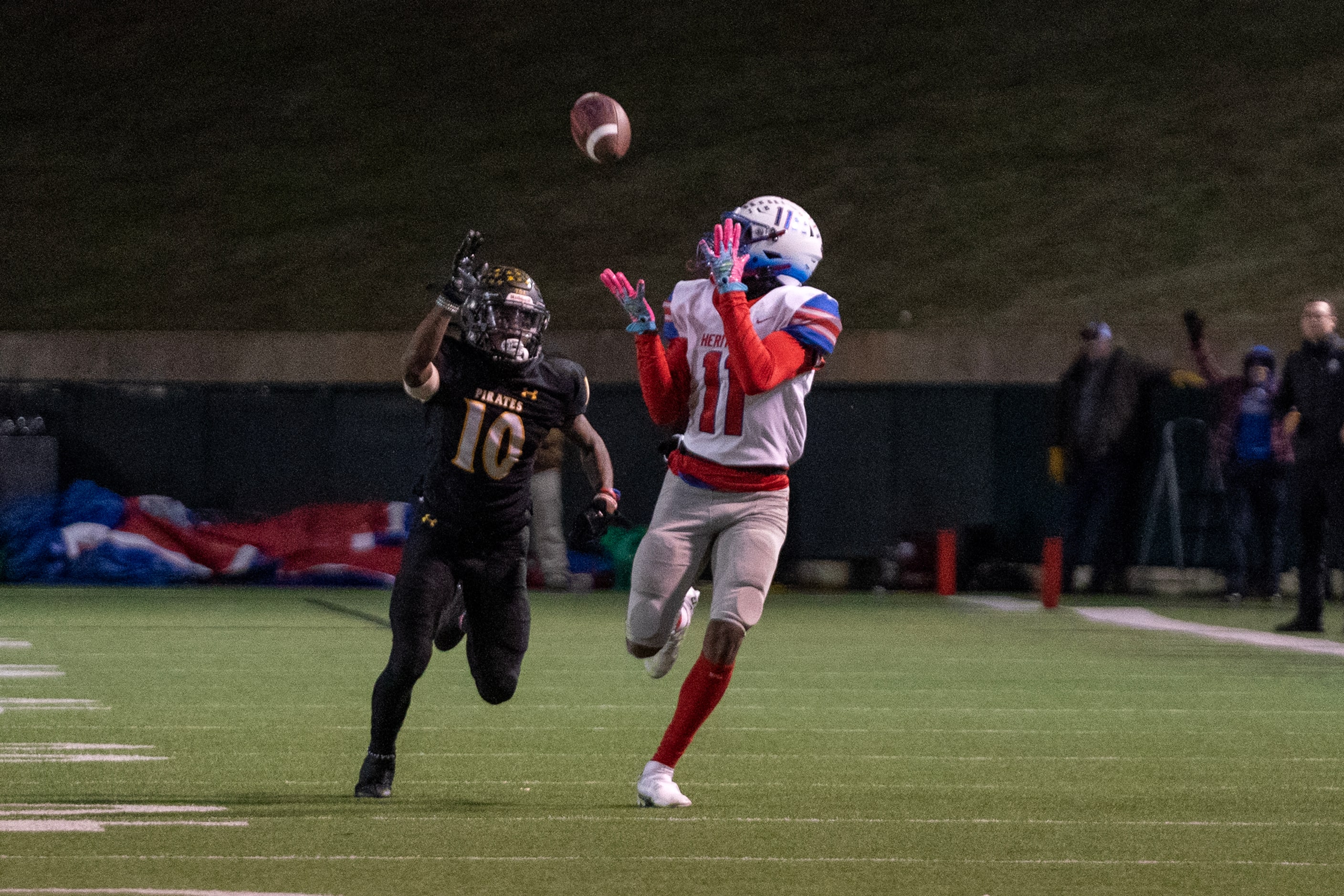 Midlothian Heritage senior wide receiver Xavier Moten (11) hauls in a touchdown pass in...