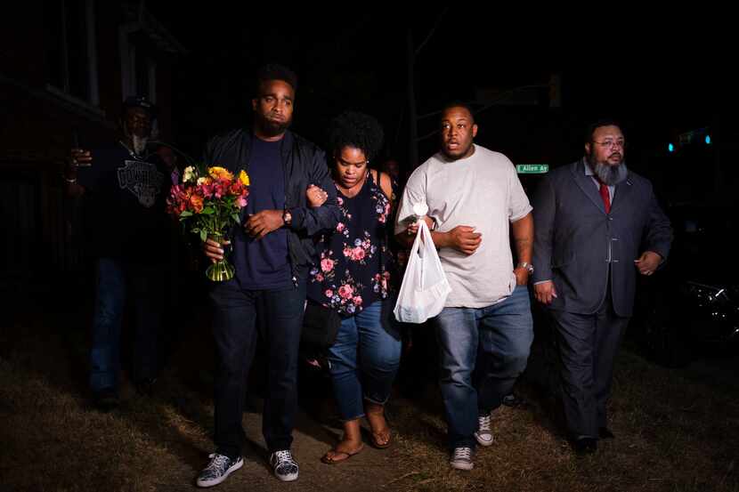 Members of the victim's family depart a community vigil for Atatiana Jefferson on Sunday,...
