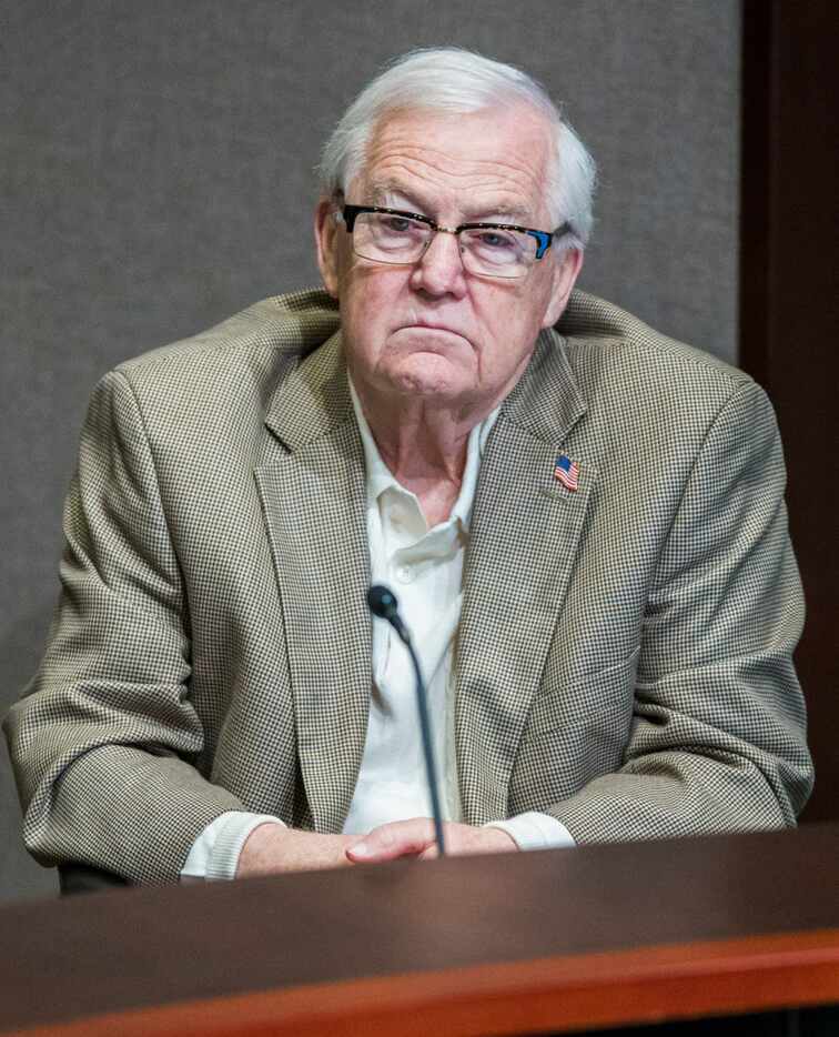 Plano City Council member Tom Harrison listens during a council meeting April 23 at Plano...