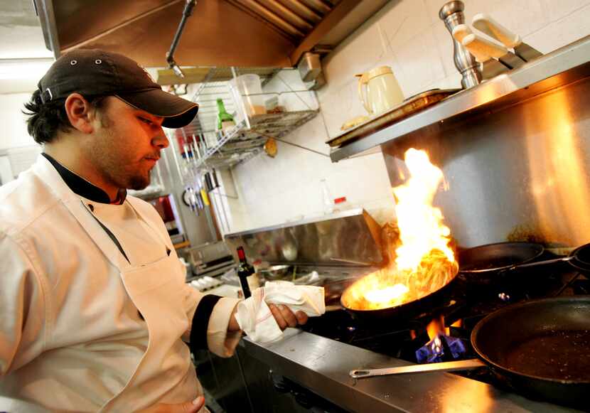 Executive chef Nicholas Pavageaux whips up a tasty organic dish at Kozy Kitchen cafe on...