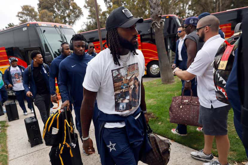 Dallas Cowboys safety Malik Hooker and his teammates arrive on buses at the Residence Inn...