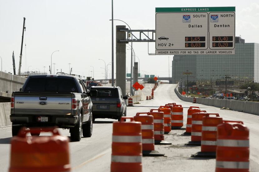 
New toll road signs on I-635 LBJ Freeway for the new toll road to I-35E north and south...