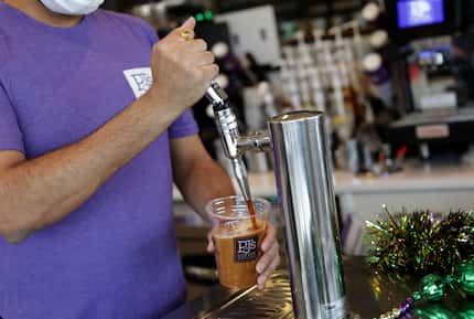 Ridham Bhatt pours a coffee at PJ's Coffee in McKinney in January 2021. The newest PJ's...