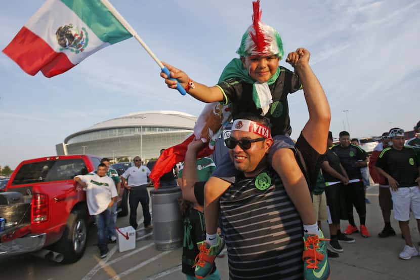 Gio Carreon of El Paso, Texas gets a ride from his dad in the parking lot before Mexico vs....