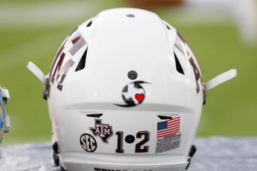 A sticker in support of Hurricane Harvey relief efforts adorn a Texas A&M football helmet...