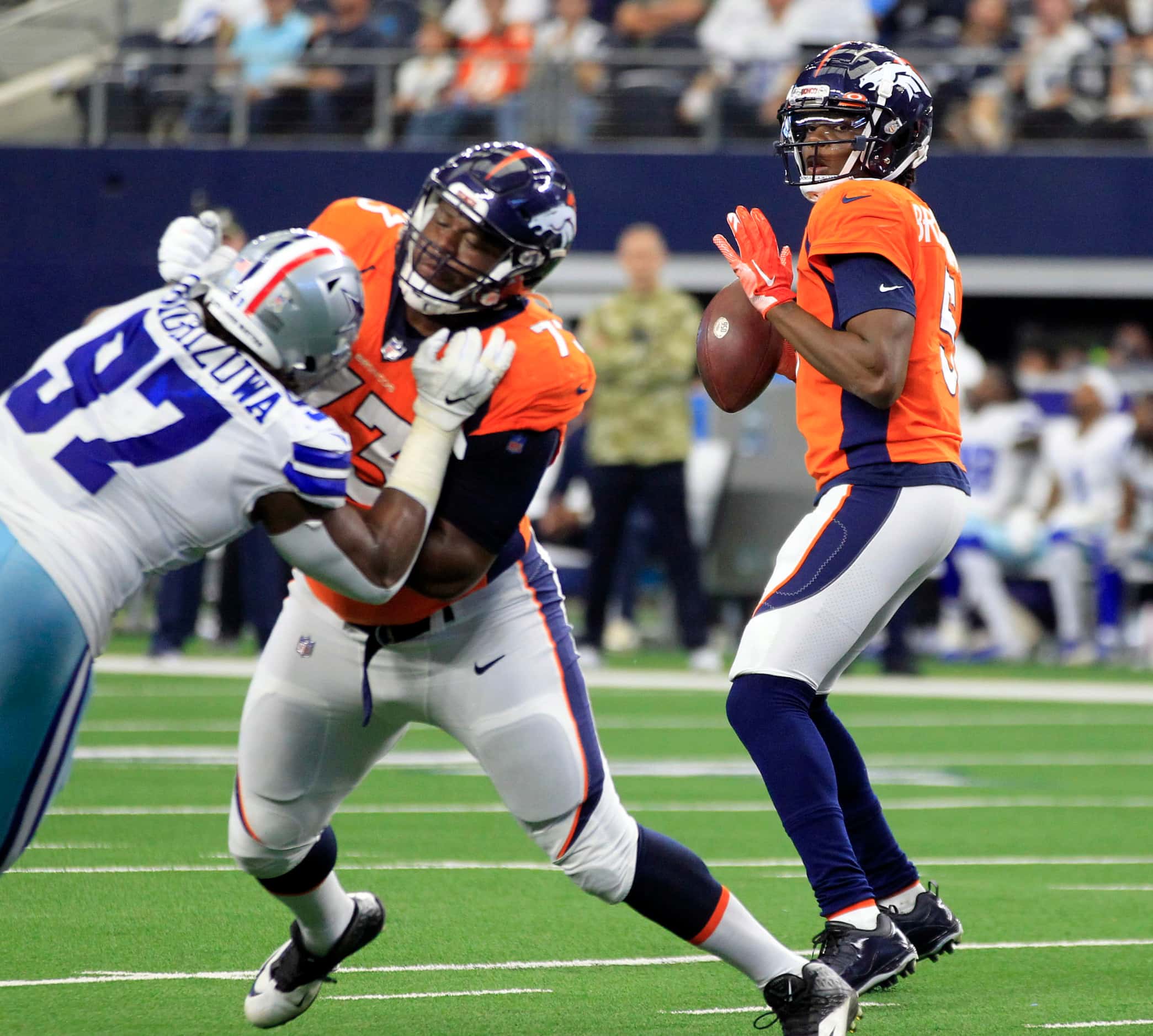 Denver Broncos quarterback Teddy Bridgewater (5) throws a pass, as Denver Broncos offensive...