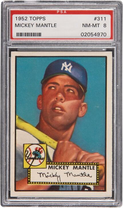A high grade 1952 Topps Mickey Mantle rookie card.