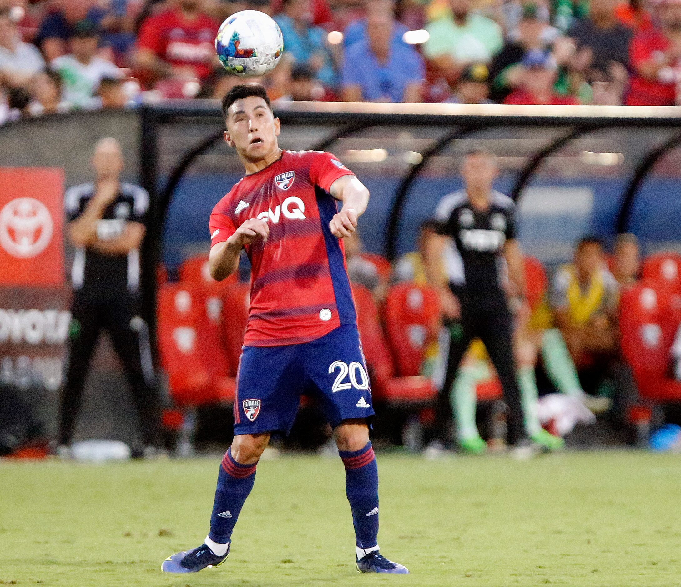 FC Dallas forward Alan Velasco (20) heads the soccer ball during the first half as FC Dallas...