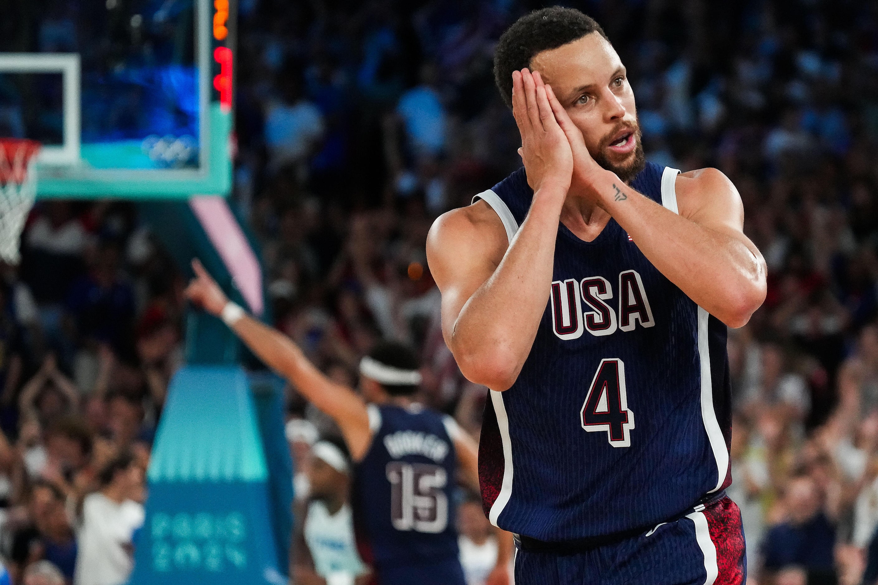 Stephen Curry (4) of the United States celebrates after hitting a late 3-pointer during the...